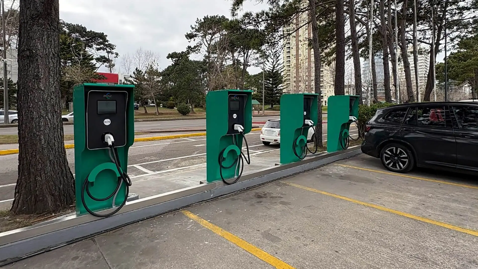 Wall-mounted EV charger in Uruguay tourist parking lot